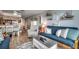 Inviting living room with nautical décor and an open layout to the kitchen and dining area at 126 N Waccamaw Dr. # 203, Garden City Beach, SC 29576