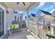 Relax on the balcony with seating overlooking neighboring properties at 138 Marblehead Dr., Little River, SC 29566