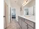 The bathroom features a double sink vanity, white trim, and access to the bedroom at 138 Marblehead Dr., Little River, SC 29566