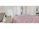 This bedroom features neutral walls, white trim, and glimpses of a staircase through an open doorway at 138 Marblehead Dr., Little River, SC 29566