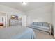 Neutral bedroom featuring a tv atop a gray dresser and a pull out bed at 138 Marblehead Dr., Little River, SC 29566