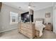 Serene bedroom featuring a large dresser, a mounted TV, a comfortable bed, and ample natural light from a window at 138 Marblehead Dr., Little River, SC 29566