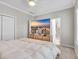 Cozy bedroom with a plush bed, a large television display, neutral tones, and an ensuite bathroom at 138 Marblehead Dr., Little River, SC 29566