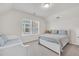 This bright bedroom offers 2 windows, white furniture, and light blue accents at 138 Marblehead Dr., Little River, SC 29566