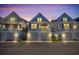 Charming coastal homes showcase covered garages and spacious balconies under a beautiful twilight sky at 138 Marblehead Dr., Little River, SC 29566