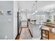 Bright kitchen featuring granite counters, an island with seating, and stainless steel appliances at 138 Marblehead Dr., Little River, SC 29566