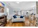 Bright and airy living room with hardwood floors, comfortable seating, a fireplace, and an open layout to the kitchen at 138 Marblehead Dr., Little River, SC 29566