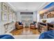 Inviting living area with hardwood floors, comfortable armchairs, a cozy fireplace, and tasteful coastal decor at 138 Marblehead Dr., Little River, SC 29566
