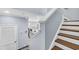 View of the staircase with wooden steps and white risers, leading down to the kitchen at 138 Marblehead Dr., Little River, SC 29566