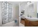 Bathroom with a shower-tub combo and a view into the connected bedroom at 1420 S Ocean Blvd., North Myrtle Beach, SC 29582