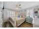 Comfortable bedroom with large windows, neutral decor, and a cozy atmosphere at 1420 S Ocean Blvd., North Myrtle Beach, SC 29582