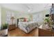 Bright bedroom featuring a wicker bed frame, wood floors, and decorative coastal accents at 1420 S Ocean Blvd., North Myrtle Beach, SC 29582