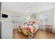 Cozy bedroom with bright decor, wood floors, and a ceiling fan at 1420 S Ocean Blvd., North Myrtle Beach, SC 29582