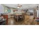 Open dining room with rustic decor, adjacent to an open kitchen with barstool seating at 1420 S Ocean Blvd., North Myrtle Beach, SC 29582