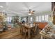 Dining room with rustic table and seating, wooden floors and decor accents at 1420 S Ocean Blvd., North Myrtle Beach, SC 29582