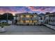 Charming two-story beach home featuring double balconies and ample parking space at twilight at 1420 S Ocean Blvd., North Myrtle Beach, SC 29582