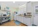 Well-equipped kitchen with modern white cabinets, stainless steel appliances, and ample counter space at 1420 S Ocean Blvd., North Myrtle Beach, SC 29582