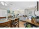 Eat-in kitchen features a dining table with seating for eight and modern appliances, offering functionality and style at 1420 S Ocean Blvd., North Myrtle Beach, SC 29582