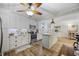 Stylish kitchen with white cabinetry, stainless steel appliances, and a central island at 1420 S Ocean Blvd., North Myrtle Beach, SC 29582