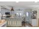 Kitchen with stainless steel appliances, island, and unique light fixture at 1420 S Ocean Blvd., North Myrtle Beach, SC 29582