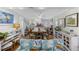 Bright living room features a dining table with seating for eight at 1420 S Ocean Blvd., North Myrtle Beach, SC 29582