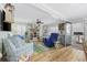 Cozy living room with comfortable seating, wood floors, ceiling fan, and beach-themed decor at 1420 S Ocean Blvd., North Myrtle Beach, SC 29582