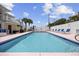 Outdoor pool with lounge chairs and clear blue water at 1420 S Ocean Blvd., North Myrtle Beach, SC 29582