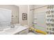 Well-lit bathroom with a white vanity, framed artwork, and a tub with a shower at 1431 Porchfield Dr., Conway, SC 29526