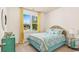 Charming bedroom with vibrant bedspread, bright yellow curtains and natural light from the window at 1431 Porchfield Dr., Conway, SC 29526