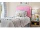 This charming bedroom features a pink headboard, white bedding, and a decorative heart-shaped pillow at 1431 Porchfield Dr., Conway, SC 29526