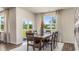 Well-lit dining room featuring a wooden table with six chairs, and sliding glass doors at 1431 Porchfield Dr., Conway, SC 29526