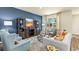 Inviting living room with cozy seating, a stylish entertainment center, and ample natural light at 1431 Porchfield Dr., Conway, SC 29526