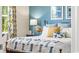 Comfortable bedroom boasts an inviting bed with accent pillows and natural light from the window at 1431 Porchfield Dr., Conway, SC 29526
