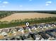An aerial view showing the home's location, set near a tranquil field in a residential community at 145 Copper Leaf Dr., Myrtle Beach, SC 29588