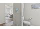 A view into the bathroom with toilet and a view into the living room area at 145 Copper Leaf Dr., Myrtle Beach, SC 29588