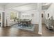 Bright dining room with a large window, area rug, and modern chandelier at 145 Copper Leaf Dr., Myrtle Beach, SC 29588