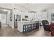 Bright kitchen with white cabinets, island with barstool seating and stainless steel appliances at 145 Copper Leaf Dr., Myrtle Beach, SC 29588
