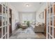 Cozy living room with large windows, comfortable furniture and stylish decor at 145 Copper Leaf Dr., Myrtle Beach, SC 29588