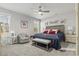Spacious main bedroom featuring a tray ceiling, ceiling fan, sitting area, and ensuite bathroom at 145 Copper Leaf Dr., Myrtle Beach, SC 29588