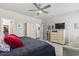 Spacious main bedroom featuring a tray ceiling, ceiling fan, sitting area, and ensuite bathroom at 145 Copper Leaf Dr., Myrtle Beach, SC 29588