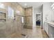 Detailed view of glass-enclosed shower with tile surround, built in bench, and dual shower heads at 145 Copper Leaf Dr., Myrtle Beach, SC 29588