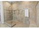 Detailed view of glass-enclosed shower with tile surround, built in bench, and dual shower heads at 145 Copper Leaf Dr., Myrtle Beach, SC 29588