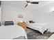 Cozy bedroom with two twin beds, ceiling fan, and colorful accent pillows at 1500 Cenith Dr. # C-103, North Myrtle Beach, SC 29582