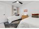 Bright bedroom with two twin beds, ceiling fan, and colorful accent pillows at 1500 Cenith Dr. # C-103, North Myrtle Beach, SC 29582