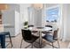 Sunlit dining area featuring modern furniture, large windows, and a view of the outdoors at 1500 Cenith Dr. # C-103, North Myrtle Beach, SC 29582