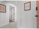 Bright hallway featuring terrazzo flooring, modern decor, and access to other rooms at 1500 Cenith Dr. # C-103, North Myrtle Beach, SC 29582