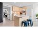 Spacious kitchen with an island and barstools connected to a bedroom area at 1500 Cenith Dr. # C-103, North Myrtle Beach, SC 29582