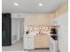 Bright kitchen featuring wood cabinetry, stainless steel appliances, and access to other living areas at 1500 Cenith Dr. # C-103, North Myrtle Beach, SC 29582