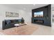 Comfortable living room featuring a stylish sofa, modern decor, and a cozy electric fireplace at 1500 Cenith Dr. # C-103, North Myrtle Beach, SC 29582