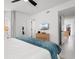Spacious main bedroom with a king-size bed, ample closet space, and a television for relaxation at 1500 Cenith Dr. # C-103, North Myrtle Beach, SC 29582